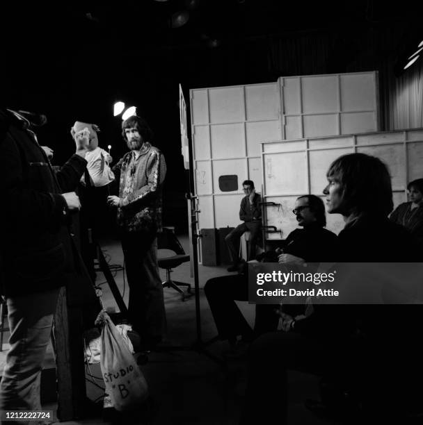 Producer Jon Stone , puppeteer Jim Henson holding an 'Anything Muppet' dentist, an unknown crew member, puppeteer Frank Oz holding an 'Anything...