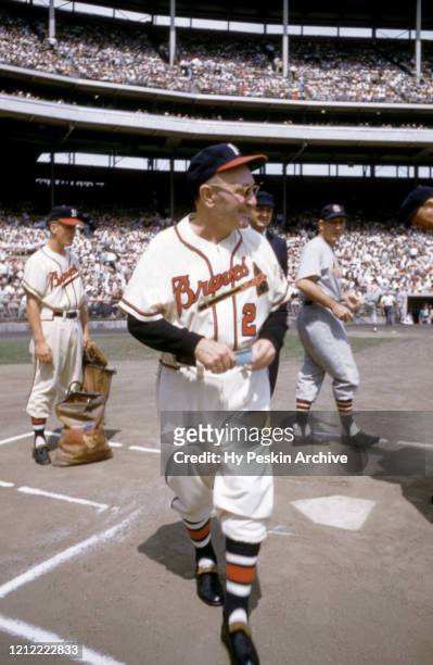 Manager Fred Haney of the Milwaukee Braves walks back to his dugout after exchanging the line-up cards before an MLB game against the St. Louis...