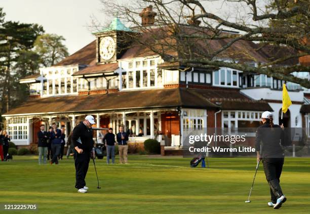 William Percival and Lily May Humphreys celebrate beating Ben Holden and Roger Chapman on the 18th green to win the Sunningdale Foursomes at...