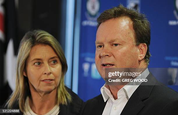 Bill Pulver , accompanied by his wife Belinda , speaks at a press conference in Sydney on August 16, 2011 following the announcement of the arrest of...