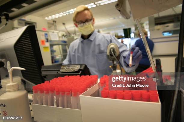 Medical Laboratory scientist tests for coronavirus at the University of Washington Medicine virology lab on March 13, 2020 in Seattle, Washington....