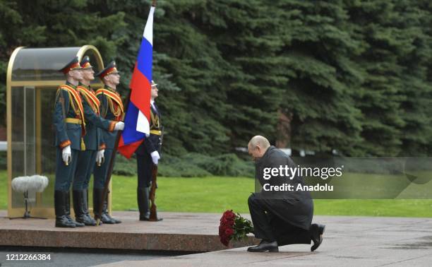 Russian President Vladimir Putin leaves roses to Tomb of the Unknown Soldier during Victory Day military parade marking the 75th anniversary of the...