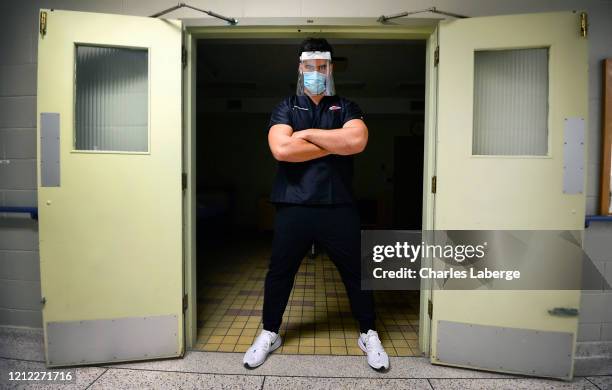 Portrait of Kansas City Chiefs offensive guard Laurent Duvernay-Tardif during photo shoot at longterm care facility. Duvernay-Tardif on the front...