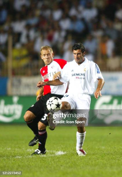 Tomasz RZASA of Feyenoord and Luis FIGO of Real Madrid during the Super Cup match between Real Madrid and Feyenoord at Stadium Louis II, Monaco on...
