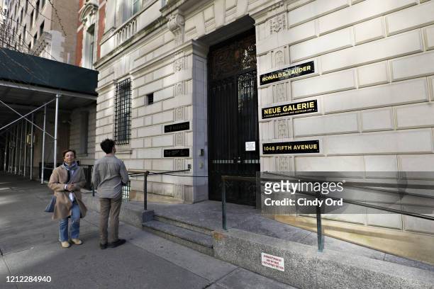 Tourists react to seeing a closed sign outside of Neue Galerie on March 13, 2020 in New York City. Due to the ongoing threat of the coronavirus...