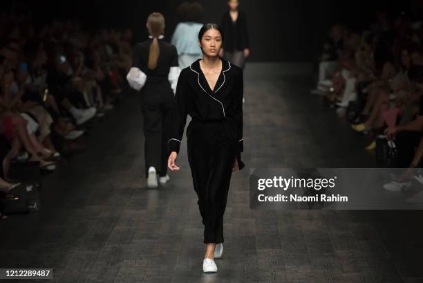 Models walk the runway in designs by White Story during Runway 2 at Melbourne Fashion Festival on March 11, 2020 in Melbourne, Australia.