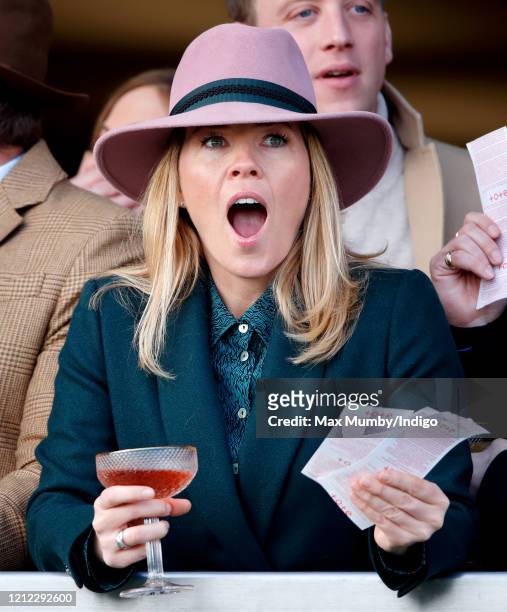 Autumn Phillips watches the racing as she attends day 4 'Gold Cup Day' of the Cheltenham Festival 2020 at Cheltenham Racecourse on March 13, 2020 in...