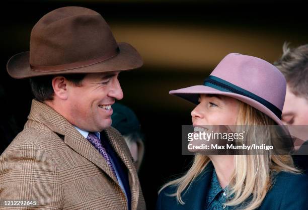 Peter Phillips and Autumn Phillips watch the racing as they attend day 4 'Gold Cup Day' of the Cheltenham Festival 2020 at Cheltenham Racecourse on...