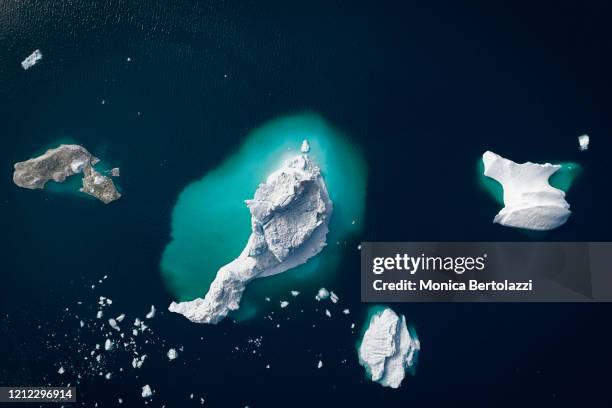 aerial view of gigantic icebergs - packeis stock-fotos und bilder