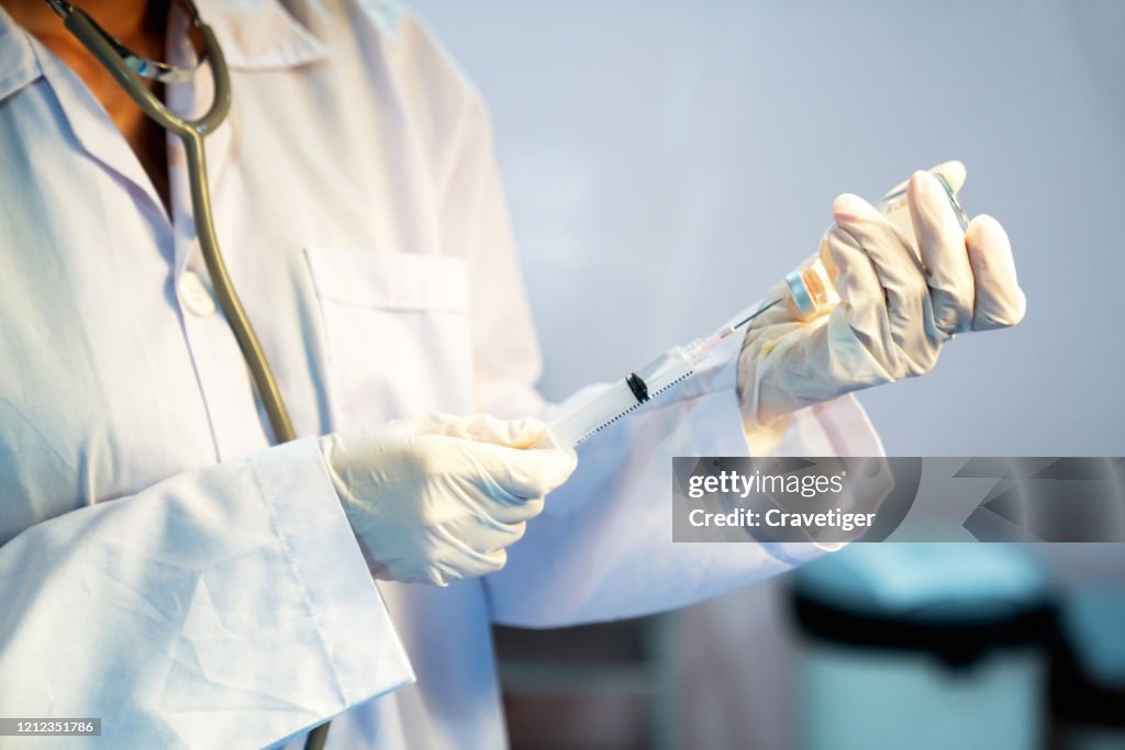 Close-Up Of Doctor Filling Medical Injection.