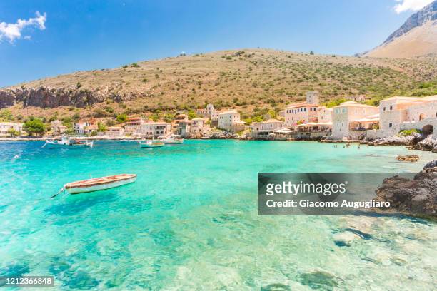 turquoise sea at the coastal village of limeni, mani region, peloponnese, greece, europe - greece foto e immagini stock