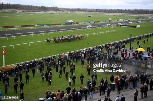 Runners pass the grandstand during The European Breeders Fund Paddy Power National Hunt EBF Novices' Handicap Hurdle Race on Silver Cups Day at...