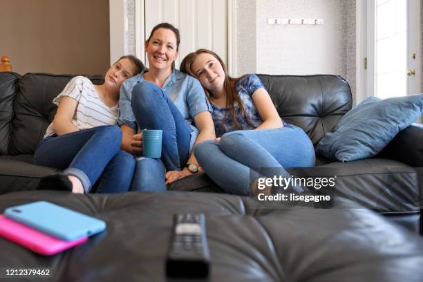 family watching tv and using internet - family tv pet stock pictures, royalty-free photos & images