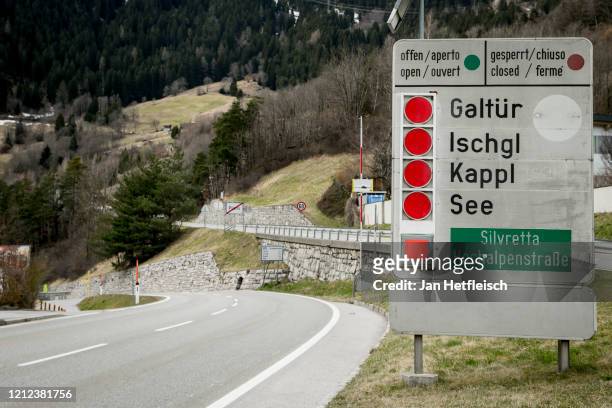 Signs at the entrance of the Panznautal valley following the imposition of a quarantine due to the coronavirus on March 14, 2020 near Ischgl,...