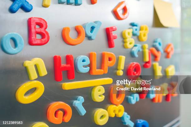 children's coloured fridge magnet letters spelling out - letra magnética fotografías e imágenes de stock