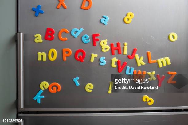 children's coloured fridge magnet letters spelling out - 英字マグネット ストックフォトと画像