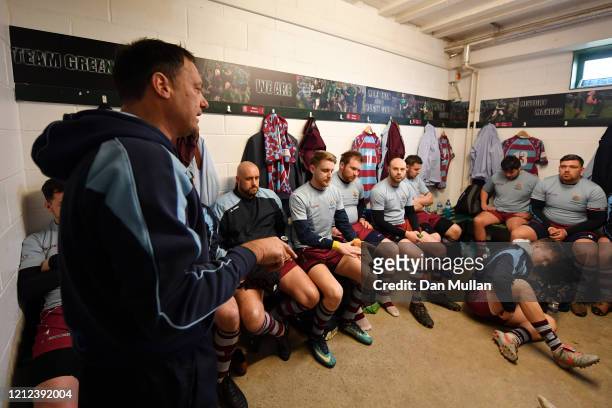 Rik Orkney, Head Coach of OPMs speaks to his players in the changing room prior to the Lockie Cup Semi Final match between Old Plymouthian and...