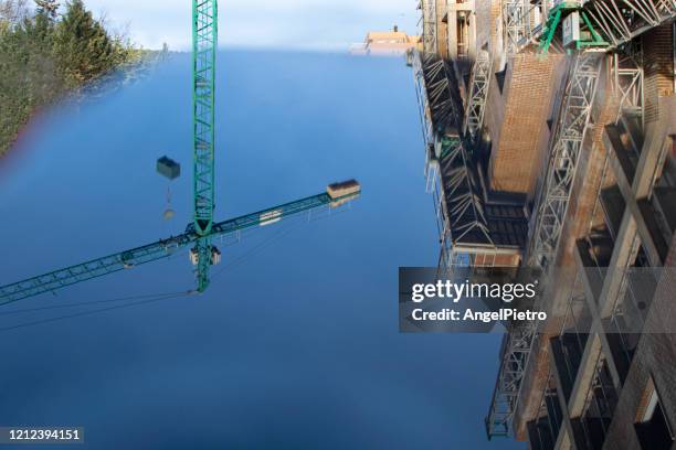 crane mobile reflection - grúa stock pictures, royalty-free photos & images