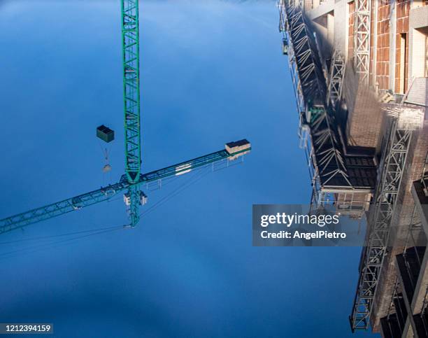 crane mobile reflection - teléfono stock pictures, royalty-free photos & images