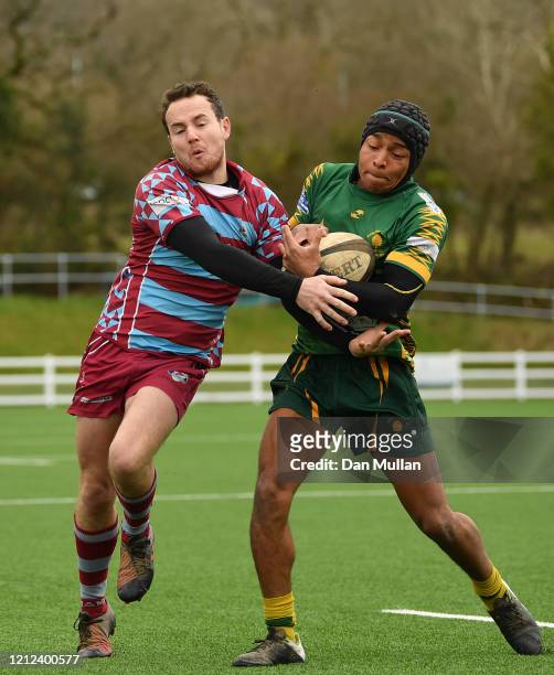 Chris Harmer of OPMs and Nicholas Bono Machado of Plymstock Albion Oaks compete for the ball during the Lockie Cup Semi Final match between Old...