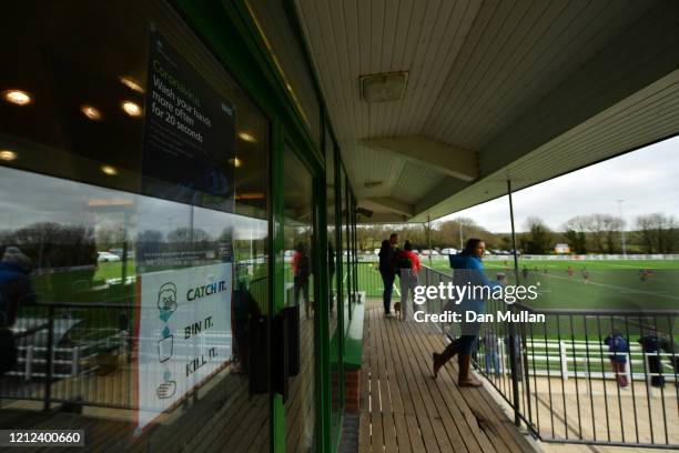 Signs advising people on Coronavirus are displayed at the clubhouse during the Lockie Cup Semi Final match between Old Plymouthian and Mannameadians...