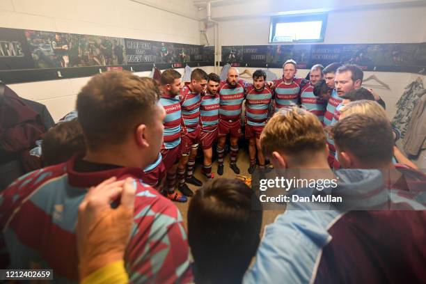 The OPM players huddle in the changing room at half time during the Lockie Cup Semi Final match between Old Plymouthian and Mannameadians and...