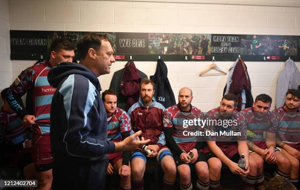 Rik Orkney, Head Coach of OPMs talks to his players in the changing room at half time during the Lockie Cup Semi Final match between Old Plymouthian...