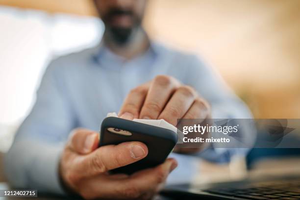 my smartphone needs a good clean - wet wipe stock pictures, royalty-free photos & images