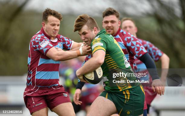 Pete Keanie of Plymstock Albion Oaks hands off Chris Harmer of OPMs during the Lockie Cup Semi Final match between Old Plymouthian and Mannameadians...