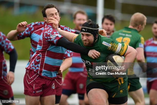 Daniel Romang of Plymstock Albion Oaks hands off Chris Harmer of OPMs during the Lockie Cup Semi Final match between Old Plymouthian and...