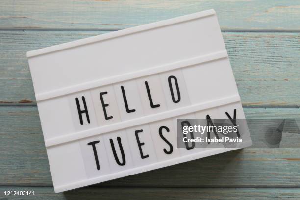 "hello tuesday" message in light box - martes fotografías e imágenes de stock