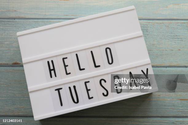 "hello tuesday" message in light box - tuesday stock pictures, royalty-free photos & images