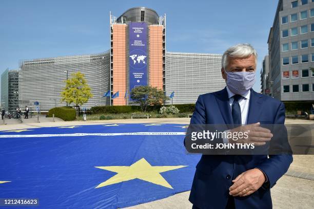 European Justice Commissioner Didier Reynders, wearing a protective face mask, speaks as he attends an event to mark Europe Day - La Journee de...