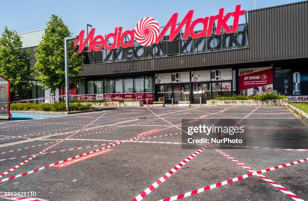 The entrance of Media markt with stickers to help people keep their distance in Oostakker, Belgium on May 9, 2020. Belgium will start phase two with...