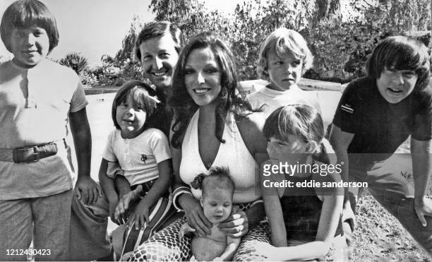 Actress Joan Collins and husband Ron Kass with their family in Marbella, Spain in 1972. Photo includes their new baby Katyana, Joan's children Tara...