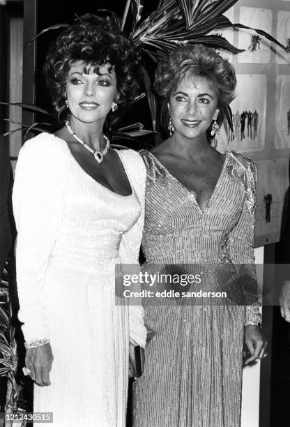 Actresses Joan Collins and Elizabeth Taylor, both wearing Nolan Miller dresses, wait in anticipation of meeting Princess Anne at a 1995 function for...