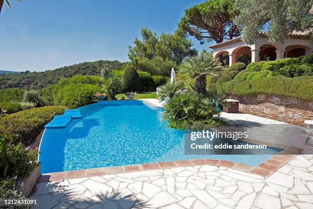 The stunning infinity pool in the grounds of Joan Collins luxury villa in the hills above San Tropez in the South of France. August 2013. .