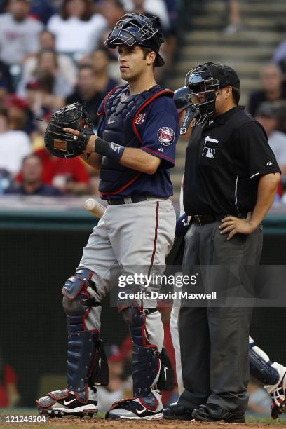 Catcher Joe Mauer of the Minnesota Twins stands behind the plate against the Cleveland Indians during the third inning of their game on August 13,...