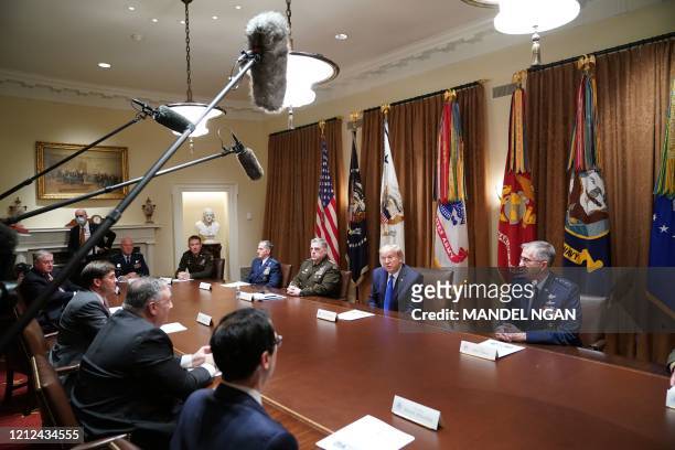 President Donald Trump flanked by Chairman of the Joint Chiefs of Staff General Mark Milley and Vice Chairman of the Joint Chiefs of Staff General...