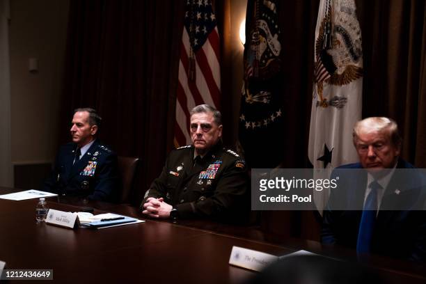 General Mark Mille­y, chair­man of the Joint Chief­s of Staff, listens during a meeting between President Donald Trump, Senior Military Leadership...