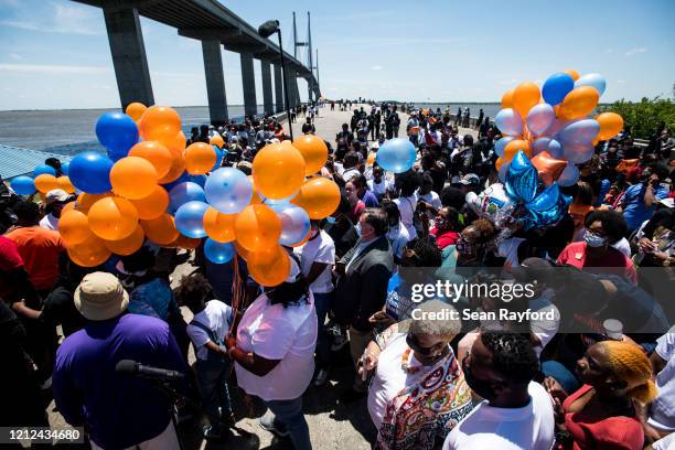 People gather to honor Ahmaud Arbery at Sidney Lanier Park on May 9, 2020 in Brunswick, Georgia. Arbery was shot and killed while jogging in the...