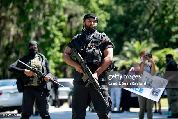 Members of the Black Panther Party, "I Fight For My People", and "My Vote is Hip Hop" demonstrate in the Satilla Shores neighborhood on May 9, 2020...