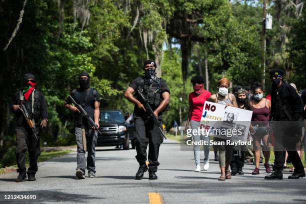 Members of the Black Panther Party, "I Fight For My People", and "My Vote is Hip Hop" demonstrate in the Satilla Shores neighborhood on May 9, 2020...