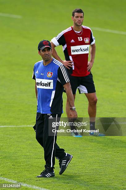 Head coach Robin Dutt and Michael Ballack attend the training session of Bayer Leverkusen at the training ground at Bayarena on August 16, 2011 in...