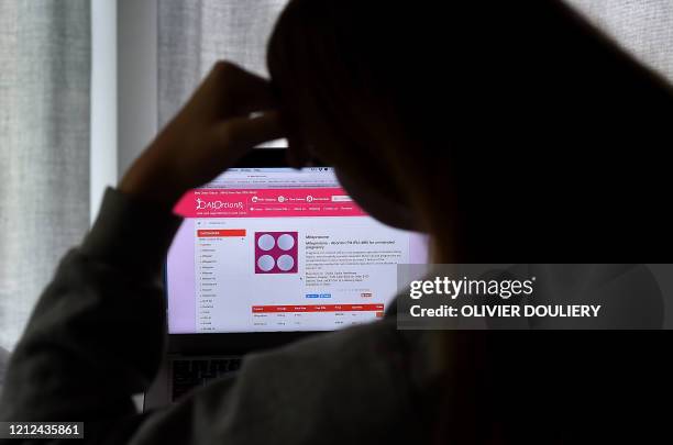 In this photo illustration, a person looks at an Abortion Pill for unintended pregnancy from Mifepristone displayed on a computer on May 8 in...