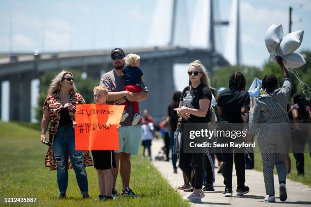 People gather to honor the life of Ahmaud Arbery at Sidney Lanier Park on May 9, 2020 in Brunswick, Georgia. Arbery was shot and killed while jogging...