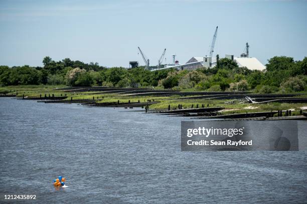 Balloons are released to honor the life of Ahmaud Arbery float in the East River on May 9, 2020 in Brunswick, Georgia. Arbery was shot and killed...
