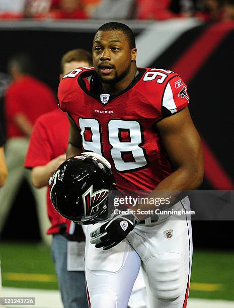 Cliff Matthews of the Atlanta Falcons warms up against the Miami Dolphins before a preseason game at the Georgia Dome on August 12, 2011 in Atlanta,...