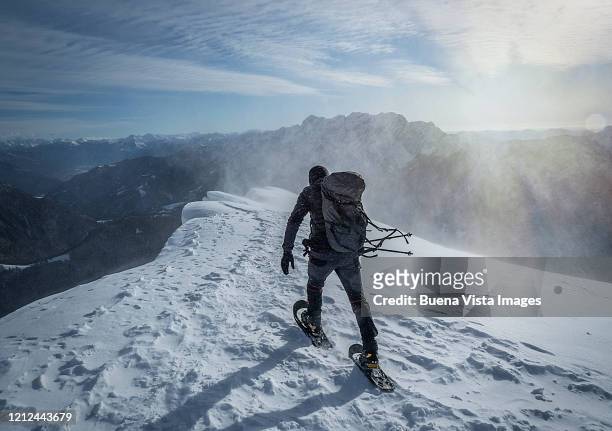 climber in a snow storm - endurance walking stock pictures, royalty-free photos & images
