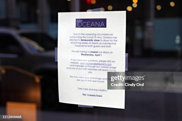Closure sign is seen in the window of Oceana on 49th Street as the coronavirus continues to spread across the United States on March 14, 2020 in New...